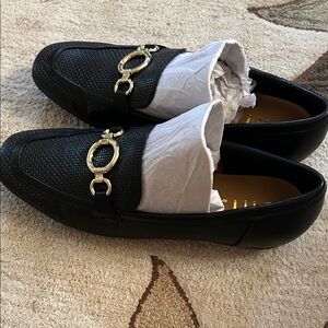 Unisa Black Loafers with Gold Accents